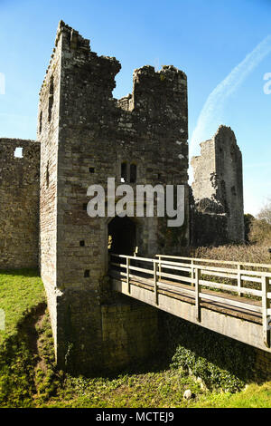 The gatehouse of Coity Castle and wooden bridge over the moat Stock Photo