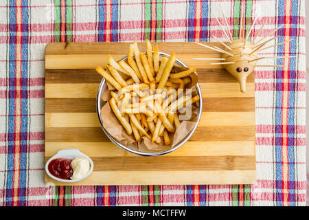 homemade ham sandwich with fried potatoes (French fries), ketchup and mayonnaise Stock Photo