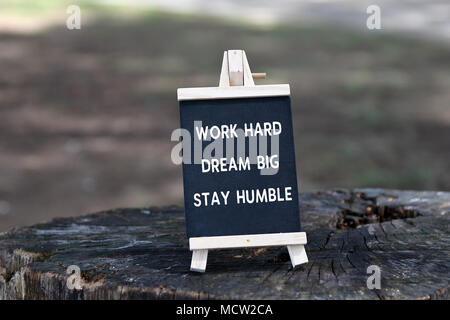 Inspirational quote - Work hard, dream big, stay humble, on black board. Stock Photo