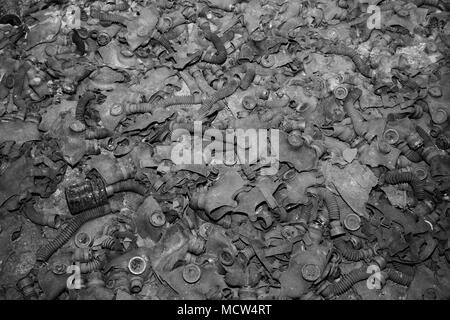 Gas masks  covering the floor of a abandoned building in Pripyat in Chernobyl Exclusion Zone, Ukraine. Stock Photo