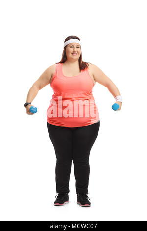 Full length portrait of an overweight woman exercising with dumbbells isolated on white background Stock Photo