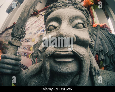Closeup of a chinese statue at the Wat Pho temple in Bangkok, Thailand Stock Photo