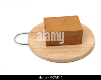 Norwegian Cheese Gjetost Brown Goats Cheese On Cheese Board With Slicer Stock Photo