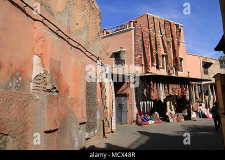 Store selling traditional Moroccan carpets at the old Medina Quarter next to the Souk, Marrakesh, Morocco Stock Photo