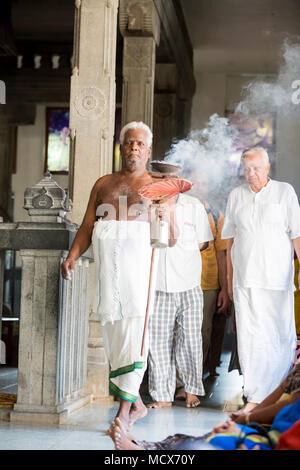 Ashram of Sri Ramana Maharshi, Tiruvannamalai, Tamil Nadu, India - March circa, 2018. Unidentified woman and man walking turning around the ashram to  Stock Photo