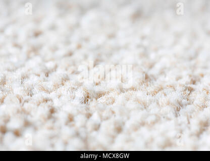 Neutral plain wool carpet rug texture closeup Stock Photo
