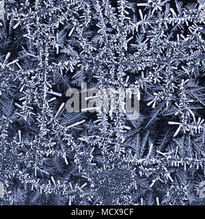 Close up of ice crystals forming an abstract pattern. Suitable for use as a background. Stock Photo
