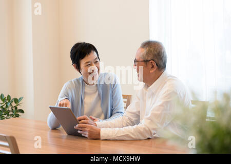 Senior couple using tablet PC Stock Photo