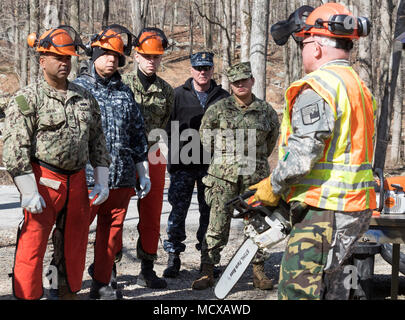 1st Sgt. Robert Rathbun, a member of the New York Guard's 102nd Engineers, delivers a block of instruction on chainsaw operation and safety at  Camp Smith Training Site, Cortlandt Manor, N.Y., Mar. 6, 2018 to memberes of the New York Naval Militia  called in to conduct debris clearance missions following a snowstorm on March 2. The New York Naval Militia consists of Navy and Marine Corps Reserve members who volunteer to report for state missions when called. The New York Guard is the state's volunteer response force. Two hundred members of the New York Army and Air National Guard, and New York Stock Photo
