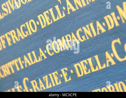 Pavia, Italy. November 16 2017. Latin inscriptions on the wall in 'Chiesa dei Santi Gervasio e Protasio Martiri' - The Church of  Saints Gervasius and Stock Photo