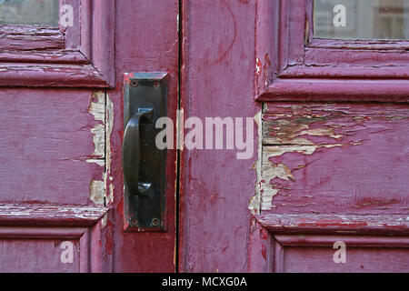 close up of an old red door on a building in Montreal Canada Stock Photo