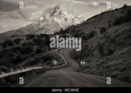 Paine Massif mountains  and road at sunrise . Torres del Paine National Park, Chile, Patagonia Stock Photo