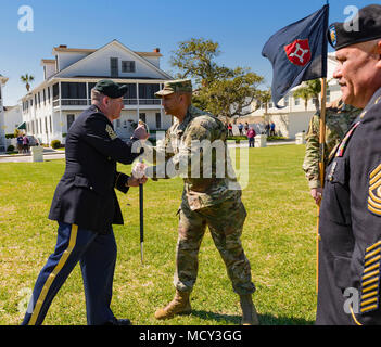 Incoming state command sergeant major for the Florida Army National Guard, Command Sgt. Maj. David Lanham, passes the Non-Commissioned Officer sword to 1st Sgt. Gregory Reynolds, Joint Forces Headquarters first sergeant during a change of responsibility ceremony Friday, March 23 at the historic St. Francis Barracks in downtown St. Augustine. Lanham received the command post held previous by Command Sgt. Maj. Enrique Mendez who retired with over 35 years of National Guard service. Stock Photo