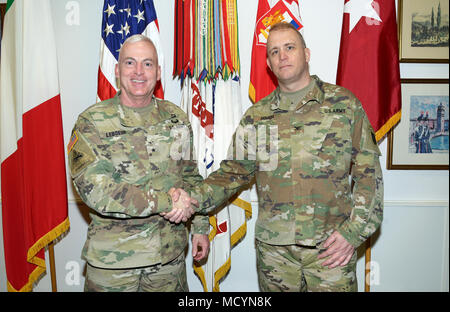 From left, Brig. Gen. Eugene J. LeBoeuf, acting Commander of U.S. Army Africa, and Col. Richard Hough II, Combined Joint Task Force Horn of Africa, Army Command Element; pose for a photograph in the USARAF commander's office during a recent visit to Caserma Ederle, Vicenza, Italy Feb. 26, 2018. (Photo by U.S. Army Davide Dalla Massara) Stock Photo