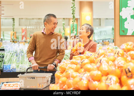 Senior couple shopping in supermarket Stock Photo