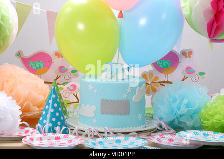 Birthday party with blue cake and balloons with empty space for text Stock Photo