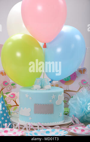 Birthday party with blue cake and balloons with empty space for text Stock Photo