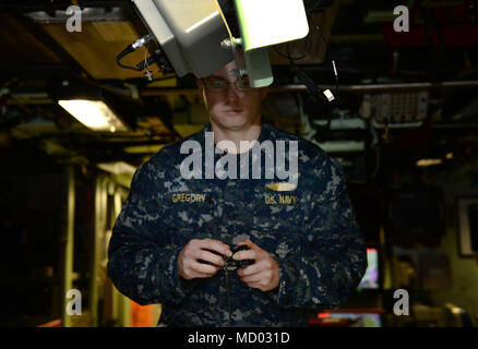 180302-N-LW91-022 GROTON, Conn. (Feb.02, 2018) Lt. jg. William Gregory uses a XBOX game controller to maneuver the photonic mast aboard Pre-Commissioning Unit Colorado (SSN 788) during a tour of the Colorado. Colorado is the 15th Virginia-class attack submarine and is scheduled to be commissioned March 17, 2018. (U.S. Navy photo by Mass Communication Specialist First Class Steven Hoskins/Released) Stock Photo