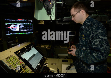 180302-N-LW91-032 GROTON, Conn. (Feb.02, 2018) Lt. jg. William Gregory uses a XBOX game controller to maneuver the photonic mast aboard Pre-commissioning Unit Colorado (SSN 788) during a tour of the Colorado. Colorado is the 15th Virginia-class attack submarine and is scheduled to be commissioned March 17, 2018. (U.S. Navy photo by Mass Communication Specialist First Class Steven Hoskins/Released) Stock Photo