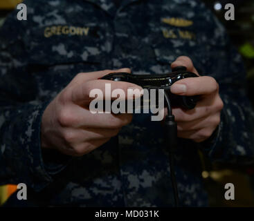 180302-N-LW91-033 GROTON, Conn. (Feb.02, 2018) Lt. jg. William Gregory uses a XBOX game controller to maneuver the photonic mast aboard Pre-Commissioning Unit Colorado (SSN 788) during a tour of the Colorado. Colorado is the 15th Virginia-class attack submarine and is scheduled to be commissioned March 17, 2018. (U.S. Navy photo by Mass Communication Specialist First Class Steven Hoskins/Released) Stock Photo