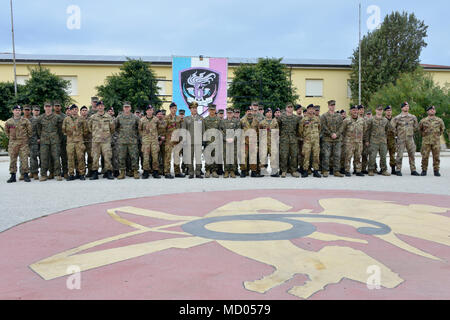 Special Purpose Marine Air-Ground Task Force-Crisis Response-Africa is a U.S. Marine Corps formation tasked with crisis-response and theater-security missions in Europe and Africa. The archival image shows Marines and soldiers of the 6th Bersaglieri Regiment assembled for a group photograph on March 7, 2018, in Trapani, Italy, during a joint training exercise. Stock Photo