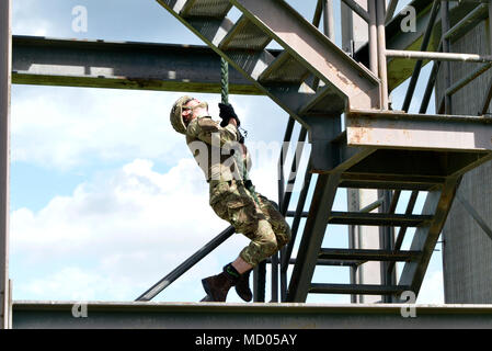 A Royal Marine Commando fast ropes from a Royal Air Force ...