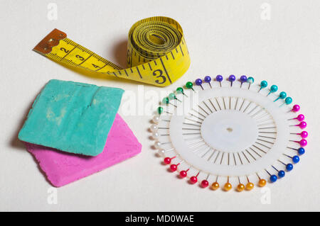 Tailoring tools and accessories, pins, measuring tape, marker. Stock Photo