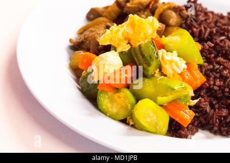 Cost-up Thai food menu is rice berry,Stir-fried Zucchini with Eggs,Shrimps and pork and and curry on white background. It copy space and selection foc Stock Photo