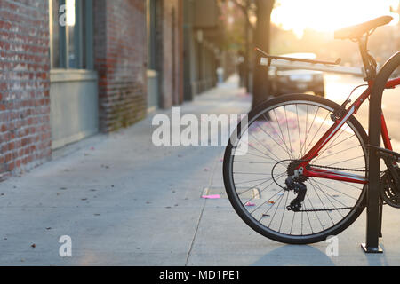 Beautiful romantic sunset city street with a bicycle, European style of life in Pasadena, California. Stock Photo