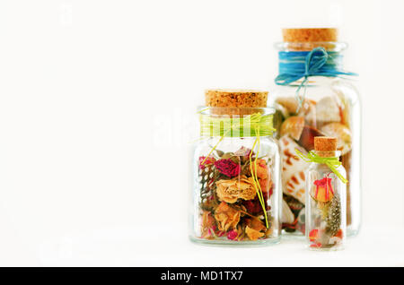 Sand and shells in bottle on white background. Free space for your text. Stock Photo