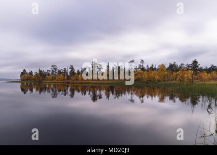 Lake and autumn colours in Muonio, Lapland, Finland Stock Photo