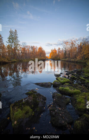 River and autumn colours in Muonio, Lapland, Finland Stock Photo