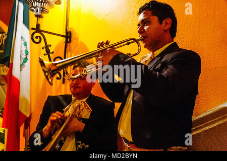 Two Mexican trumpet players in mariachi uniform perform at Focolare Restaurant first opened in 1953 on the premises of an old traditional hacienda hou Stock Photo