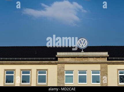 Brunswick, Lower Saxony, Germany - April 15, 2018: Upper part of the Volkswagen administration building with a large VW logo and lot of space above in Stock Photo