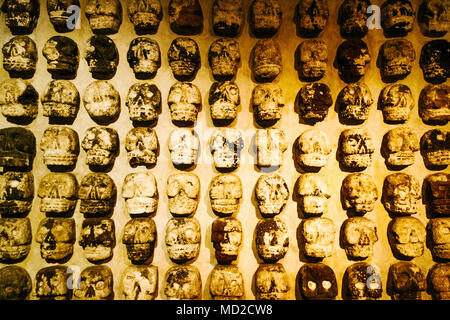 Aztec stone skulls found at the Templo Mayor site. They represent the tzompantli or skull racks where the heads of sacrificial victims were placed. Te Stock Photo