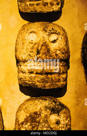 Aztec stone skulls found at the Templo Mayor site. They represent the tzompantli or skull racks where the heads of sacrificial victims were placed. Te Stock Photo