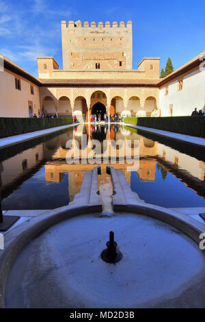 Granada, Andalusia, Spain - February 15th, 2009 : Visitors by the Tower of Comares and reflecting pool in the Court of the Myrtles (Patio de los Array Stock Photo