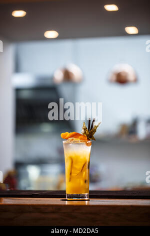 Refreshing cold non-alcoholic summer citrus cocktail with orange, ginger and crushed ice Stock Photo