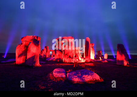 Stonehenge in Wiltshire is lit up by Finnish light artist Kari Kola to mark UNESCO World Heritage Day and as part of activities to mark 100 years of care and conservation to the prehistoric monument. Stock Photo