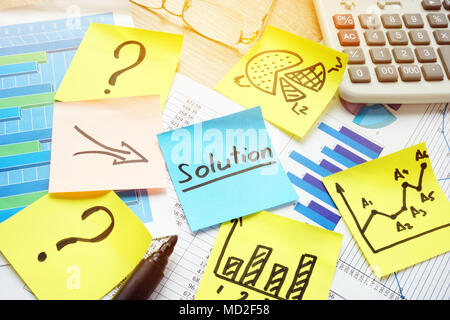 Question marks and arrows to word solution. Solving of problems in business. Stock Photo