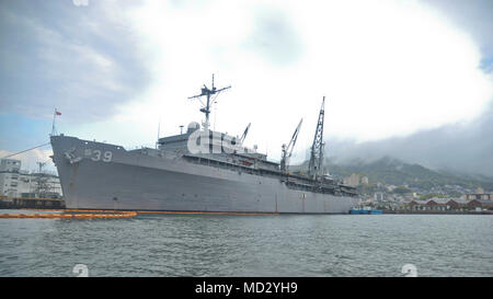 180411-N-YJ133-127  SASEBO, Japan (April 11, 2018) The submarine tender USS Emory S. Land (AS 39) is moored at Commander, Fleet Activities Sasebo during a deployment as an expeditionary submarine tender conducting coordinated tended moorings and afloat maintenance to Navy units. Land and USS Frank Cable (AS 40), the U.S. Navy’s only two submarine tenders, both homeported in Apra Harbor, Guam, provide maintenance, hotel services and logistical support to submarines and surface ships in the U.S. 5th and 7th Fleet areas of operation. (U.S. Navy photo by Mass Communication Specialist 2nd Class Ric Stock Photo