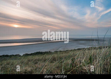 The beach at the Maasvlakte near the Port of Rotterdam in the Netherlands during sunset. Stock Photo