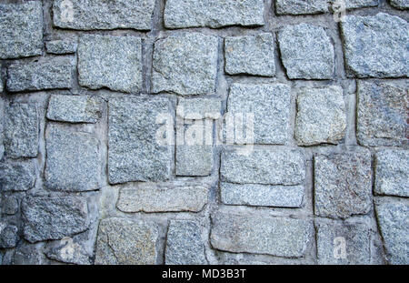 Wall of grey stones and concrete background texture Stock Photo