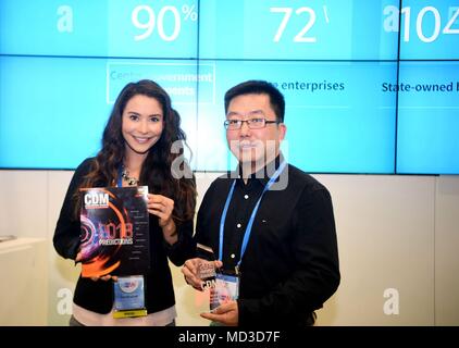 San Francisco, USA. 17th Apr, 2018. Cyber Defense Magazine (CDM) Marketing Director Sarah Brandow (L) presents the Cutting Edge Award trophy to 360 ESG President Wu Yunkun in San Francisco, the United States, April 17, 2018. China's leading Internet security company, 360 Enterprise Security Group (360 ESG), Tuesday was honored with the Cutting Edge Award for its outstanding achievements in Internet endpoint security at an annual global information security conference here. Credit: Wu Xiaoling/Xinhua/Alamy Live News Stock Photo