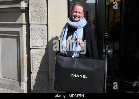 Copenhagen, Denmark. 18th Apr, 2018. French chain Chanel opens its first shop ever in Copenhagen first consumer with Chanel shopping bag and consumer waiting outside in line at chanel shop to shopping today on its first day of Chanel business in Copenhagen Denmaerk..       (Photo.Francis Joseph  Dean / Deanpictures. Credit: Francis Joseph Dean / Deanpictures/Alamy Live News