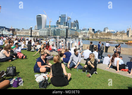 London UK. 18th April 2018. Lunch workers enjoy the spring sunshine and warm temperatures on London Riverside on a beautiful spring day  in the capital Credit: amer ghazzal/Alamy Live News Stock Photo