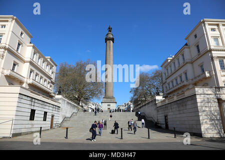 London, UK. 18th April 2018. Pedestrians walk past the Duke of York statue, designed by Sir Richard Westmacott, in The Mall in central London on 18 April, 2018. Credit: Dominic Dudley/Alamy Live News Stock Photo