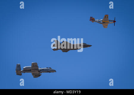 The Heritage Flight, comprising of the P-51 Mustang, F-35 Lightning II and A-10 Thunderbolt, performs a fly by during Luke Days at Luke Air Force Base, Ariz., March 17, 2018. Luke Days demonstrates the capabilities of modern military and civilian airpower through the display of more than 30 live air and ground demonstrations and static exhibits. (U.S. Air Force photo by Staff Sgt. Tyler J. Bolken) Stock Photo