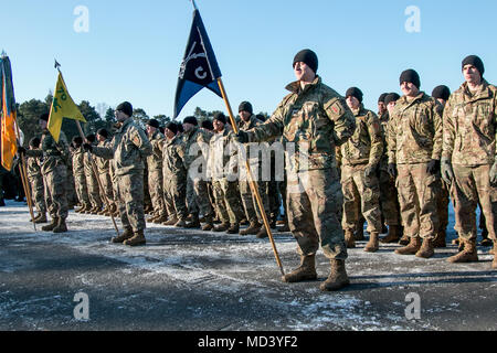 Soldiers from 2nd Battalion, 70th Armor Regiment, 2nd Armored Brigade Combat Team, 1st Infantry Division, Fort Riley, Kansas stand in formation while participating in a welcoming ceremony hosted by the Polish army in Świętoszów, Poland, March 19, 2018. (U.S. Army photo by Spc. Dustin D. Biven / 22nd Mobile Public Affairs Detachment) Stock Photo