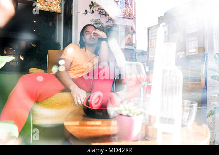 Young man relaxing in bar Stock Photo